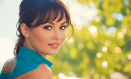 woman with blue dress posing for a photo