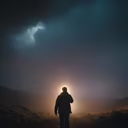 a man is in the midst of dark skies