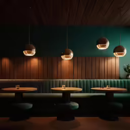 a restaurant with three chairs and wooden walls