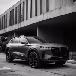 a silver car is parked in front of a building
