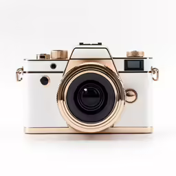 an artistic golden and white camera on a white background