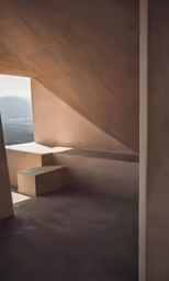 a concrete structure with some benches and an opening