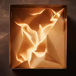 an open square box sitting on top of a table
