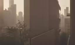 the view from the window of an old building shows a lot of tall buildings