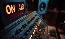 sound equipment sitting in a music studio with on air