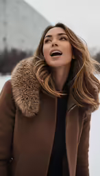 a young woman looks off into the distance