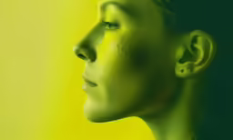 a woman with a green make up of her face and ear
