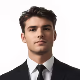 the young man is dressed in a black suit