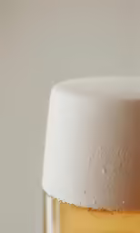 a white cake topped with a little candle