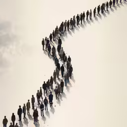a large group of people walking across the snow