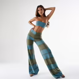 a woman with her hand on her hip posing for a picture
