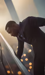 the man in a suit is walking up the ramp