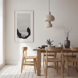a table and chairs sit in the middle of a room