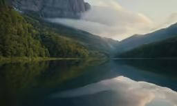 a reflection of mountains in a lake
