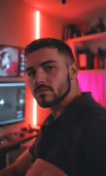 a man is staring in front of a computer