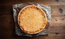 there is a very large pie on some foil