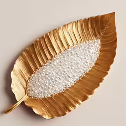 decorative golden leaf with pearls on its leaves