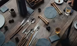 empty plates and silverware sit on the table