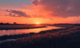 a river is shown as the sun sets