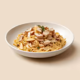 pasta and chicken is served in a bowl