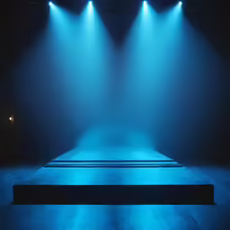 a stage with two large spotlights on it