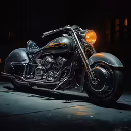 a motorcycle parked in the darkness on a street