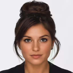 a girl with makeup and an updo is staring at the camera