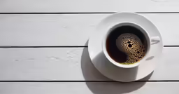 top view of a white cup of coffee