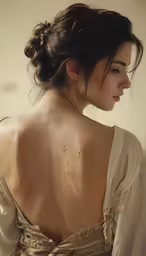 a woman with long hair in a low bun