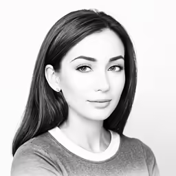a woman posing for a black and white photo