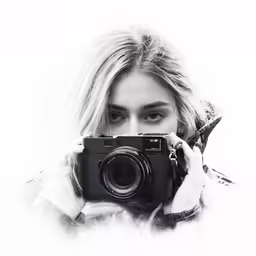 a woman with a camera in her hands
