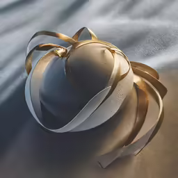 a grey and gold ball on a blue surface