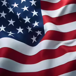 an american flag is waving on the wind