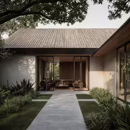 a home has a cement sidewalk and glass doors