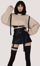 a woman with black boots posing for the camera