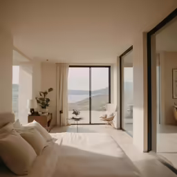 this bedroom is overlooking the mountains and ocean